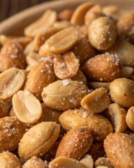 Close-Up of Assorted Salted Nuts in a Wooden Bowl on Rustic Table