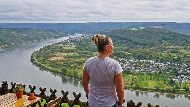 Tourist taking in epic aerial view over the Rhine Valley with the river bending near the town of Boppard, Germany