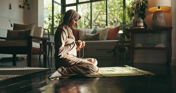 Religion, prayer and Muslim woman with beads in home for religious belief, worship and praise to Allah. Peace, spiritual and person with misbaha for praying, salaah and fasting for Ramadan Kareem