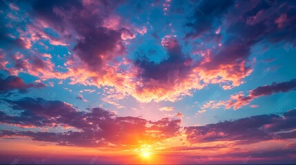 Vibrant sunset sky over ocean; dramatic cloudscape