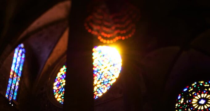 A slow pan captures the intricate beauty of the rose window at Palma de Mallorca cathedral, using a tilt-shift lens for dramatic focus.