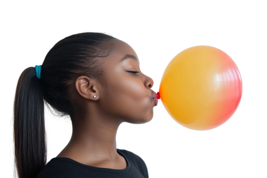 a front view image of a 18 year old african american female leaning in and blowing up a ballon with her head turned in profile to one side, ponytail, happy, on a white background