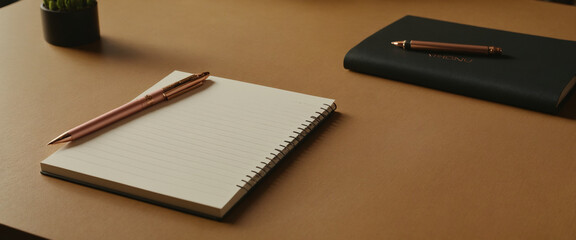 notebook and pen on the table