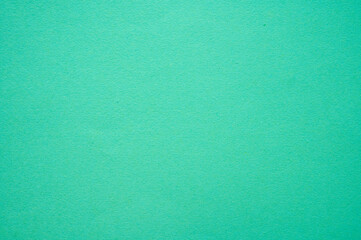 Full frame shot of light green paper sheet texture and background.