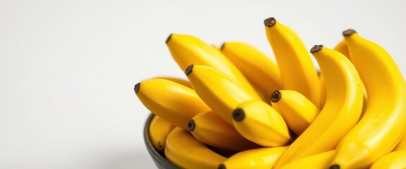 A ceramic bowl overflowing with ripe yellow bananas, nature,  natural