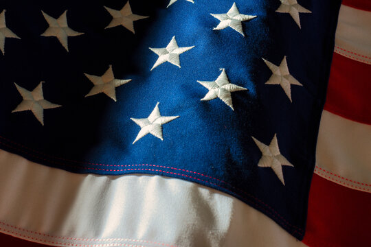 Close up studio shot of American Flag with moody light