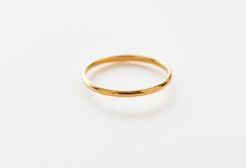 Delicate, thin gold band ring on pristine white background, photography, delicate