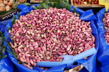 Freshly harvested pistachios displayed at local market in autumn