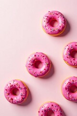 Fototapeta premium Mouth-watering pink donuts on a white background with room for your message, treats, pastry