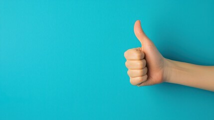 Hand showing thumbs up on blue background. Concept of approval, agreement, and success.