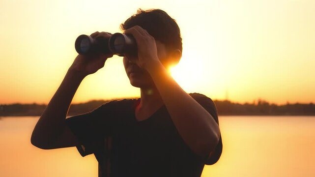 man use the binoculars.Concept perspective for future planning vision for success ideas.