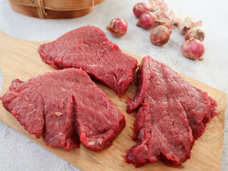 Fresh raw beef isolated on grey background. The feast of Qurban Ied al adha mubarak. food preparation