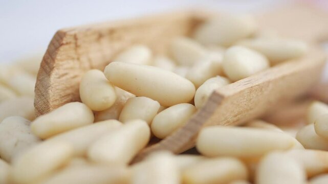 Cooking with pine nuts in a rustic kitchen setting