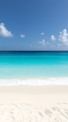 Turquoise ocean meets white sand beach