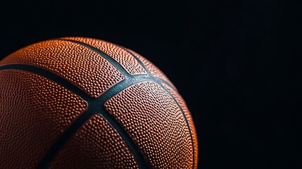 Fototapeta premium Basketball ball on a black background