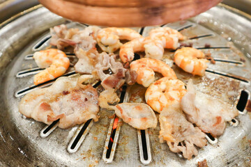 barbecued beef and shrimp or grilled shrimp and grilled beef on the broiler or Korean bbq or Thai bbq