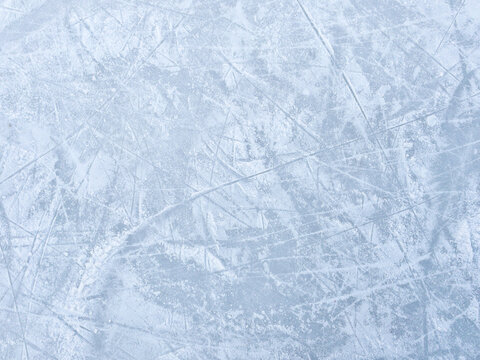 Ice background with marks from skating and hockey. Ice hockey rink scratches surface