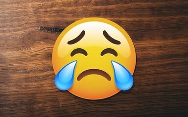 January blues, Sad emoji on wooden table