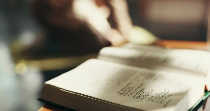 Person, prayer and closeup of Quran in home for blessing, worship and learning to praise Allah. Religious faith, spiritual teaching and open book for Islamic religion, education and praying for peace