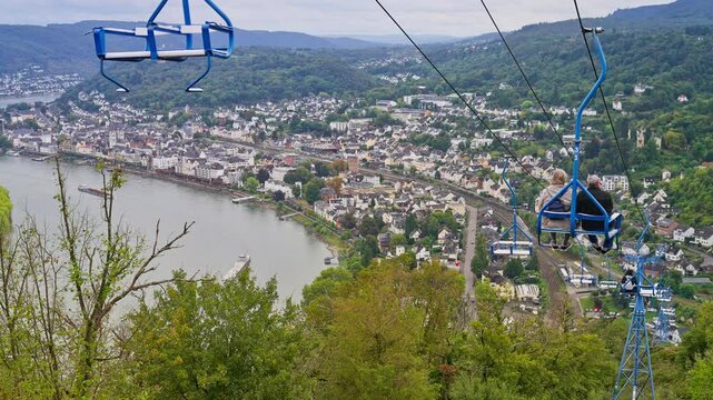 Tourist taking down the chairlift from the panoramic viewpoint over the village of Boppard, Germany