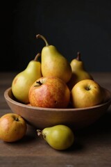 A rustic wooden bowl overflowing with ripe pears and apples, a still life of autumnal fruit