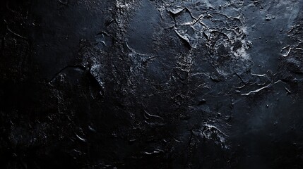 Fototapeta premium Dark abstract texture with a rough black surface and distressed grungy details for a moody atmosphere
