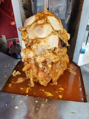 Vendor selling cuisine at street bazaar in Malaysia catered for iftar during Muslim fasting month of Ramadan