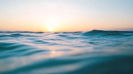 Obraz premium Serene ocean sunrise with gentle waves.