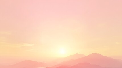 Fototapeta premium Soft pink sunrise over hazy mountain range.