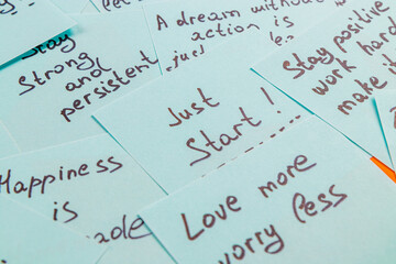 Inspirational quotes on paper cards promoting positivity and motivation