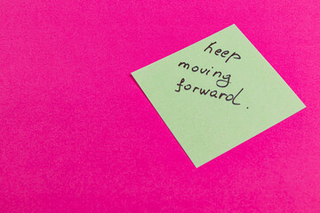 Motivational note encouraging perseverance on a bright background