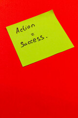 Motivational message on sticky note highlighting action and success