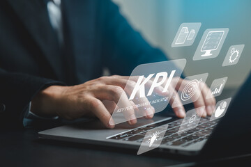 Business Analyst using KPI Metrics on Laptop for Performance Monitoring