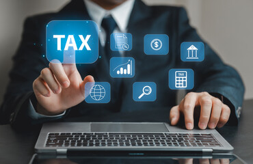 Businessman Engaging with Digital Tax Icons on Laptop Screen