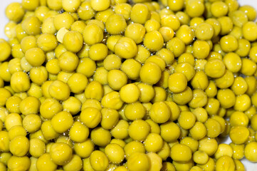 on the photo is a modern background of canned green peas