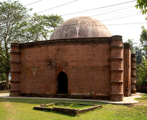 Zinda Peer Mosque in Bagerhat. featuring a historic dome and weathered bricks