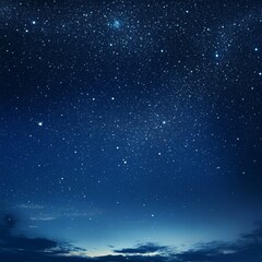 Fototapeta premium Starry night sky with a few clouds. The sky is blue and the stars are shining brightly