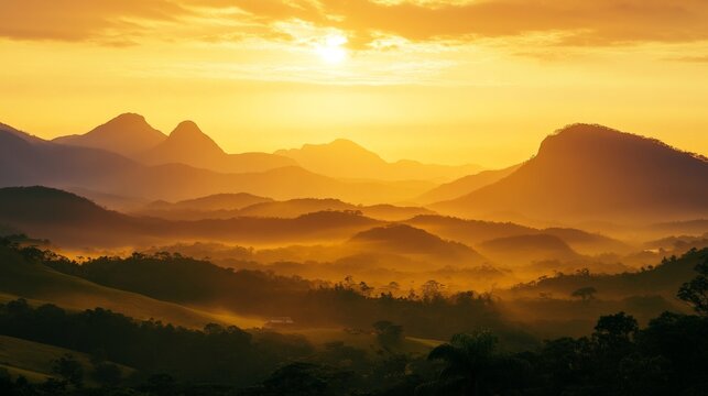 Golden sunrise over misty mountain landscape with lush greenery