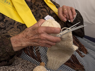 hands of a woman with kneddles