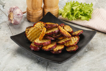 Baked red batat slices with herbs