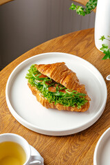 croissant with salmon and herbs