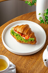 croissant with herbs and ham