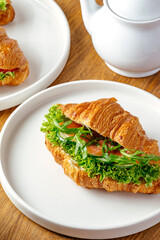 croissant with salmon and herbs