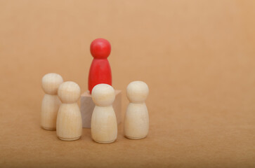 Red Leader Standing Tall: Business Leadership and Teamwork Concept