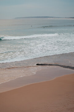 Waves rolling onto a quiet beach in Baleal, Portugal