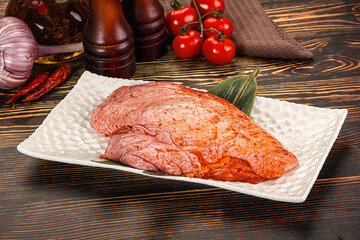 Raw marinated duck breast for cooking