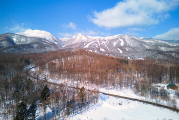 Aerial view of Snow mountain and road in winter season of sapporo hokkaido japan for trave.