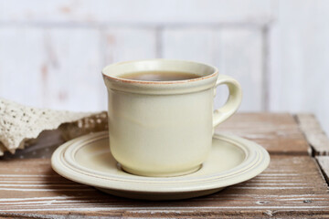 An ordinary cup of tea on a wooden table.