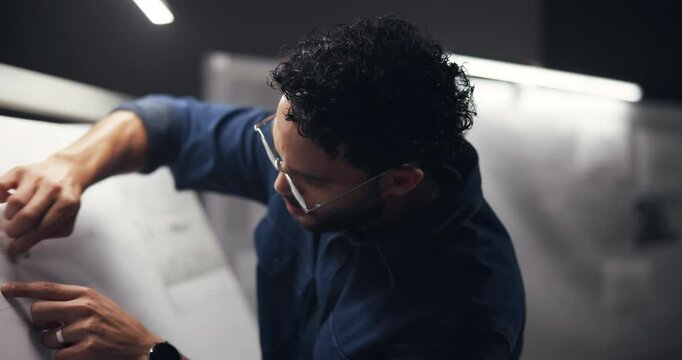 Architect, mistake and man with blueprint at night for engineering design and planning for urban project. Town planner, creative startup and person with eraser for error for drawing, sketch or layout