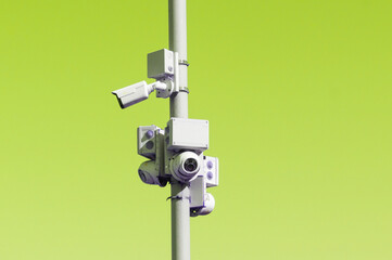A pole with surveillance cameras against the sky: the concept of total state surveillance of...